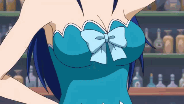 a woman in a blue dress with a blue bow on it