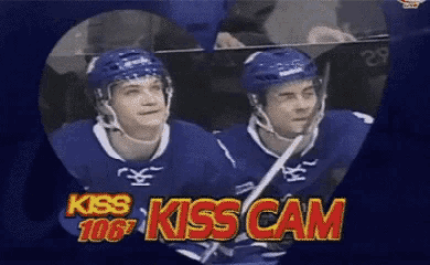 two hockey players in a heart shaped frame with the words kiss kiss cam