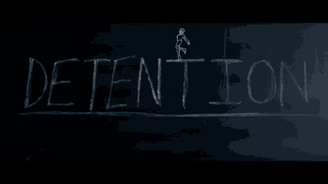 the word detention is written on a blackboard with chalk