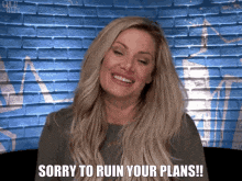 a woman is sitting in front of a brick wall and saying sorry to ruin your plans