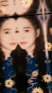 a woman 's face is reflected in a mirror with sunflowers