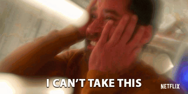a man covering his ears with his hands and the words " i can 't take this " next to him