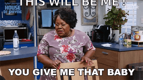 a woman sits in a chair in a kitchen with a caption that says " this will be me "