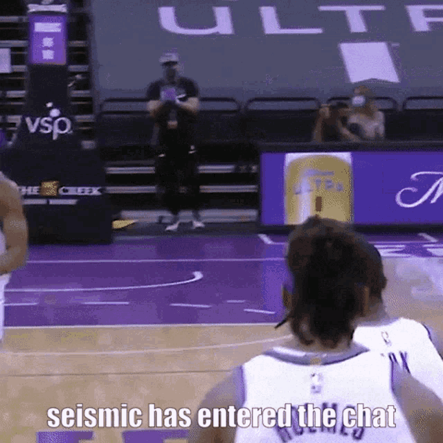 a basketball player says " seismic has entered the chat " while another player looks on