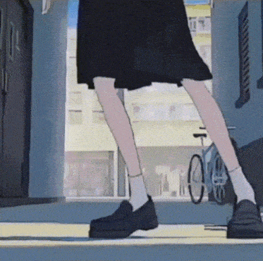 a girl in a black skirt and white socks is walking down a street
