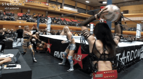 a wrestling ring with a banner that says stardom on it