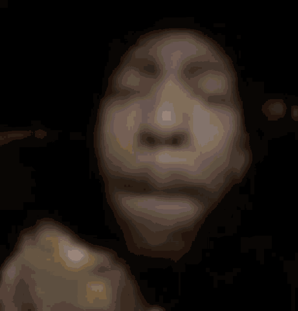 a close up of a person 's face with their eyes closed and their mouth open .