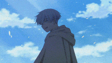 a boy in a cape stands in front of a blue sky with white clouds