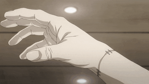 a hand with stitches on it is reaching out towards something