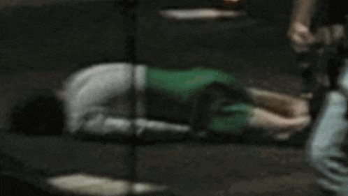 a cartoon character is laying on the floor with his hands on his stomach