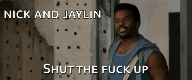a man in a blue tank top with the words nick and jaylin shut the fuck up on the bottom