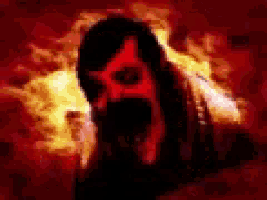 a blurred image of a man with a red face in a fire .