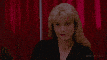 a woman in a black dress says " i 'll see you again in 25 years "