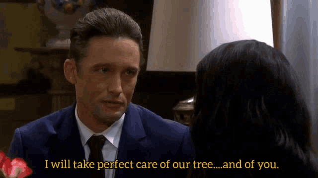 a man in a suit and tie talks to a woman who says i will take perfect care of our tree ... and of you ..