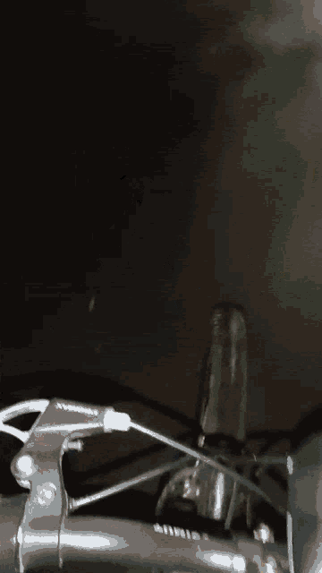 a close up of a brake lever on a bike with the word shimano on it