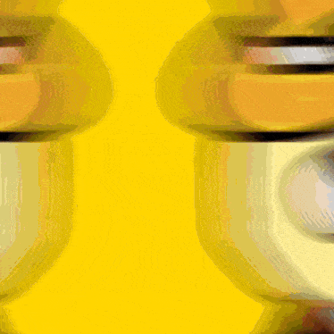 a blurred image of a face with a yellow background