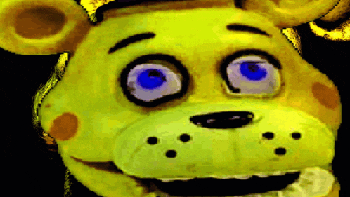 a yellow teddy bear with blue eyes is smiling