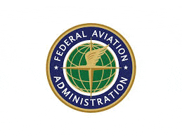 the logo for the federal aviation administration is a circle with a globe and a hand holding a torch .