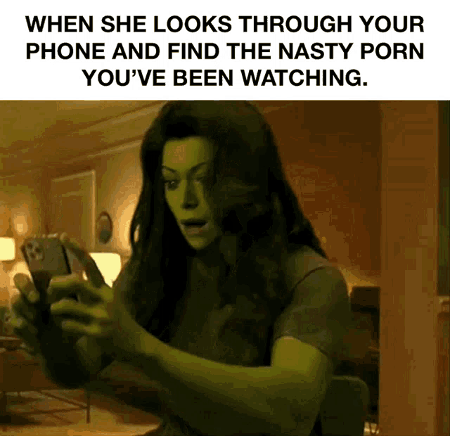 a picture of a woman looking through her phone with the caption when she looks through your phone and find the nasty porn