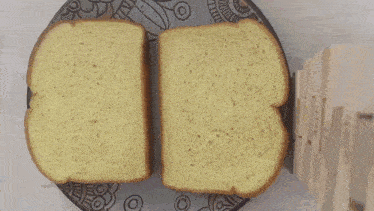 two slices of bread on a plate with a drawing of a girl on it