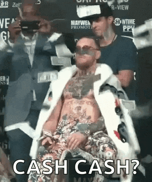 a man in a fur coat and sunglasses is sitting in a chair with the words `` cash cash '' written on the bottom .