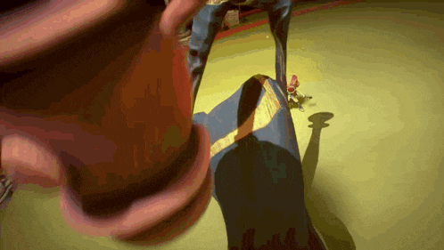 a shadow of a person is cast on the ground