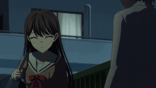a girl in a school uniform smiles while standing next to a man in a suit