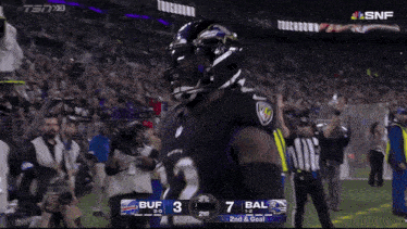 a ravens football player celebrates a touchdown during a game against the bengals