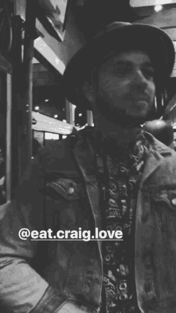 a black and white photo of a man with the name eat.craig.love on the bottom right
