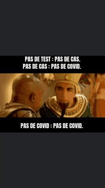 two men are talking to each other and one of them is wearing a crown and a hat .