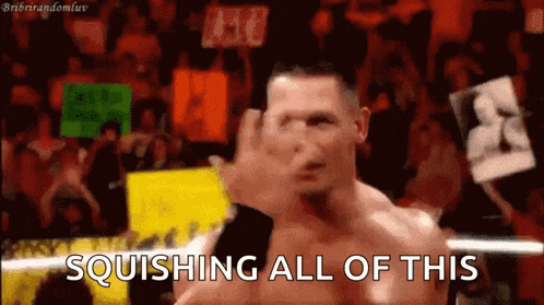 a wrestler is giving the middle finger in front of a crowd and the words squishing all of this are written below him .