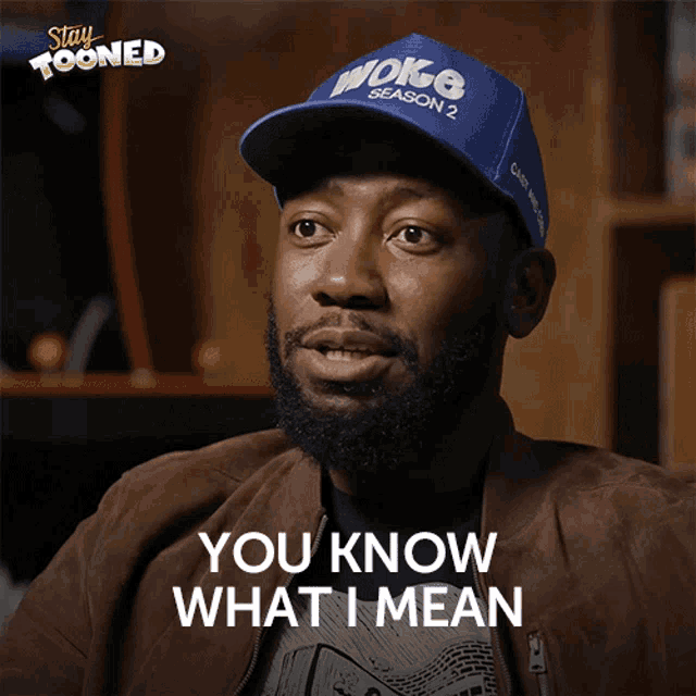 a man wearing a hat that says woke season 2 on it