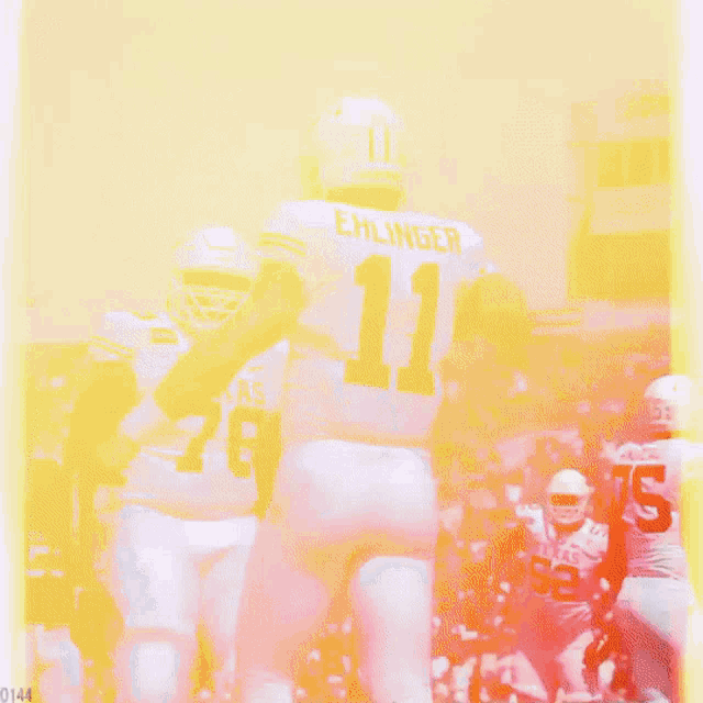 a football player named ehlinger is running with the ball