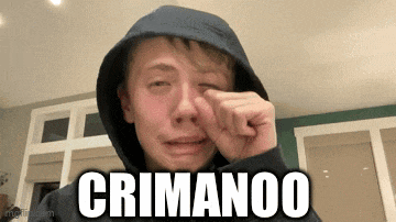 a young man in a hoodie is crying with the words crimanoo written on the bottom of his face .