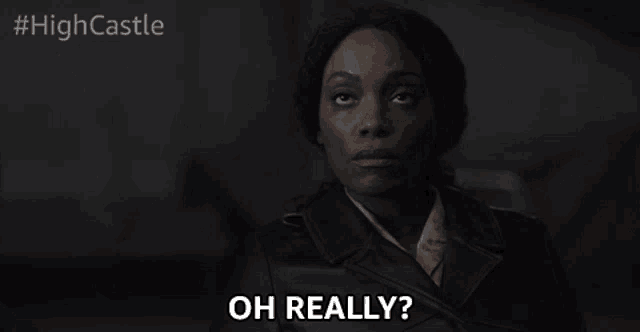 a woman in a leather jacket says oh really in a dark room