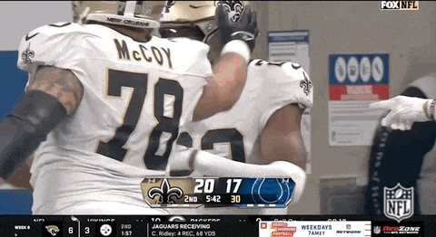 a football player with the number 78 on his jersey is hugging another player