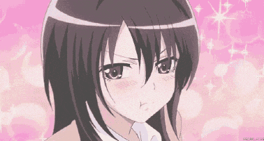 a close up of a girl 's face with a pink background behind her .