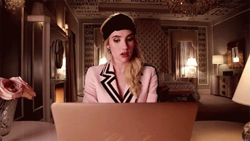 Screanqueens Emma Roberts GIF - Screanqueens Emma Roberts Looking At Laptop GIFs