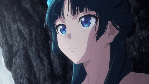 a close up of a blue eyed anime girl