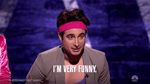 a man with a pink headband says i 'm very funny on nbc