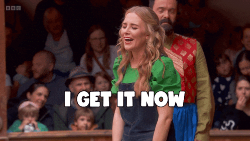 a woman says i get it now while standing in front of a crowd