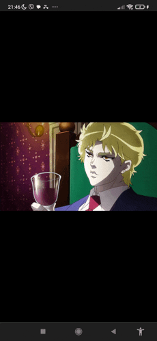 a man in a suit and tie is holding a glass of purple liquid