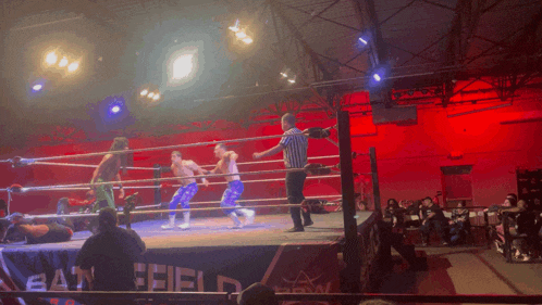 a wrestling ring with a banner that says battlefield