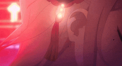 a close up of a person 's ear with a necklace on it