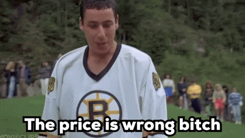 a man in a boston bruins jersey is standing on a field and says the price is wrong bitch .