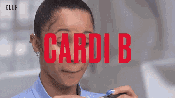 a woman making a funny face with the word cardi b in red behind her