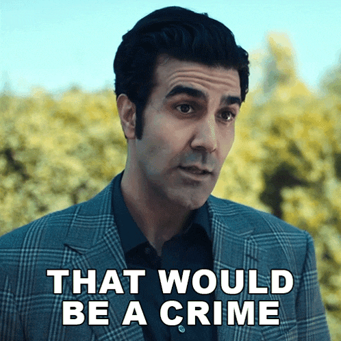 a man in a suit has the words that would be a crime on his face
