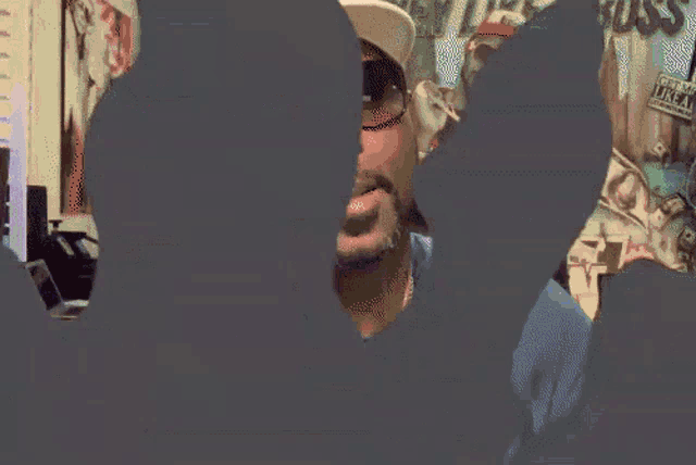a man wearing ear buds and a hat that says oklahoma