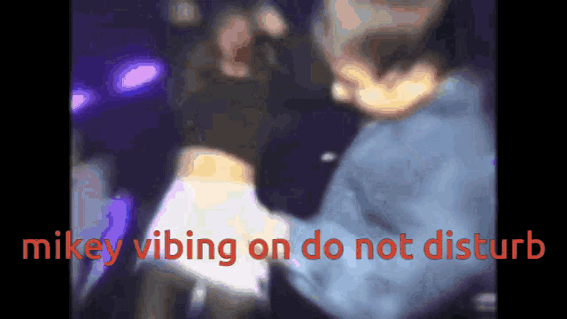 a blurred image of a person with the words " nikey vibing on do not disturb " at the bottom