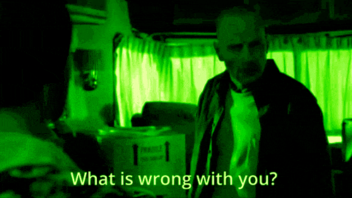 a man is standing in front of a box that says fragile
